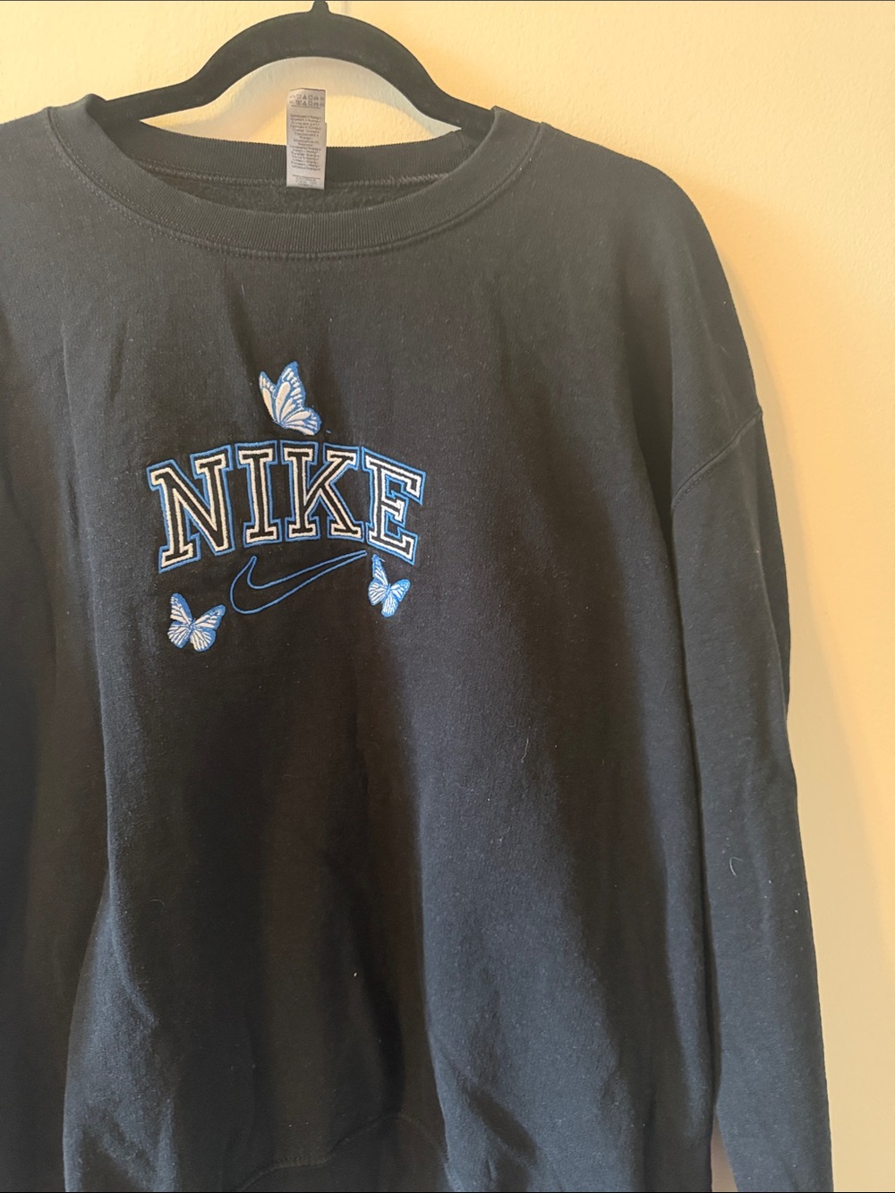 Nike Black Crewneck Sweatshirt with Blue Embroidered Logo and Butterflies